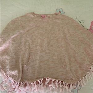 Light pink poncho with tassels
